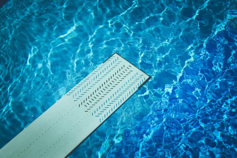 Diving board over pool